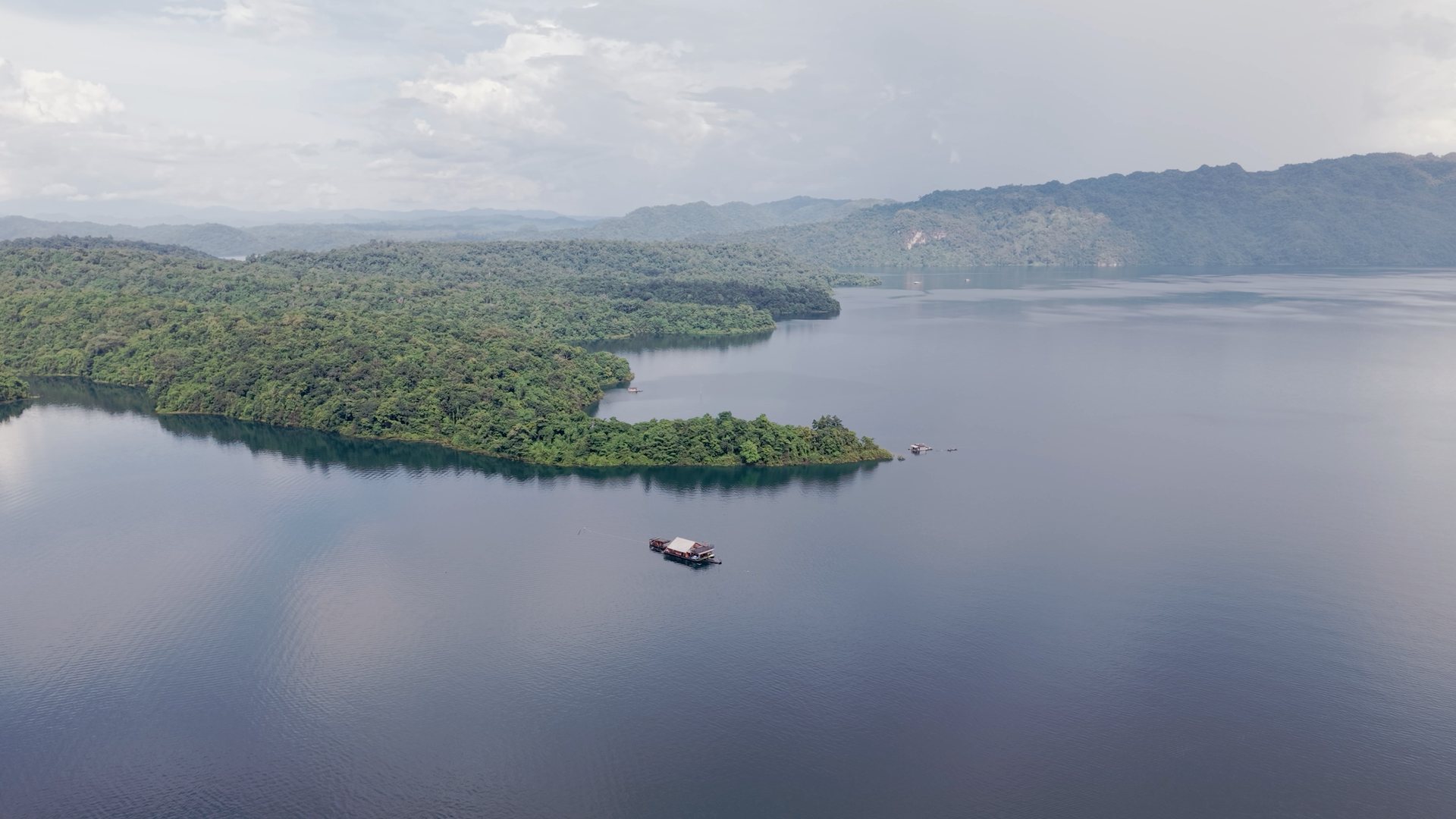 Aerial of the raft being towed across Khao Laem Lake