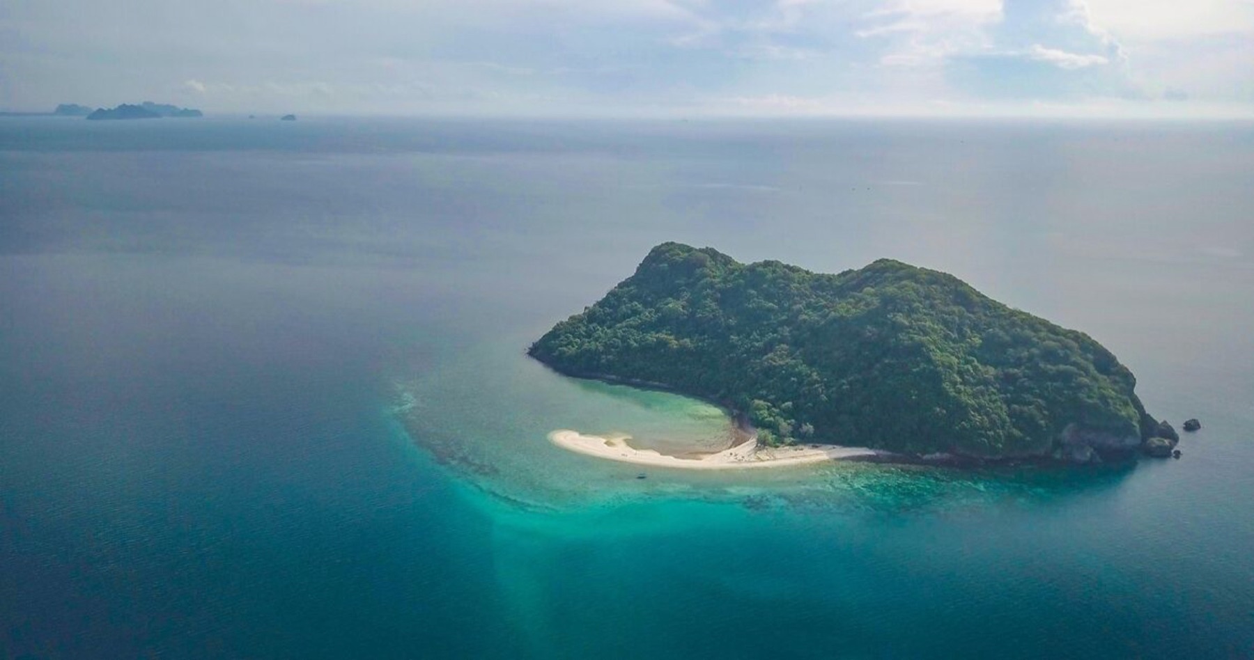 Aerial view of Koh Kye, a coral island ringed by white sand and turquoise sea